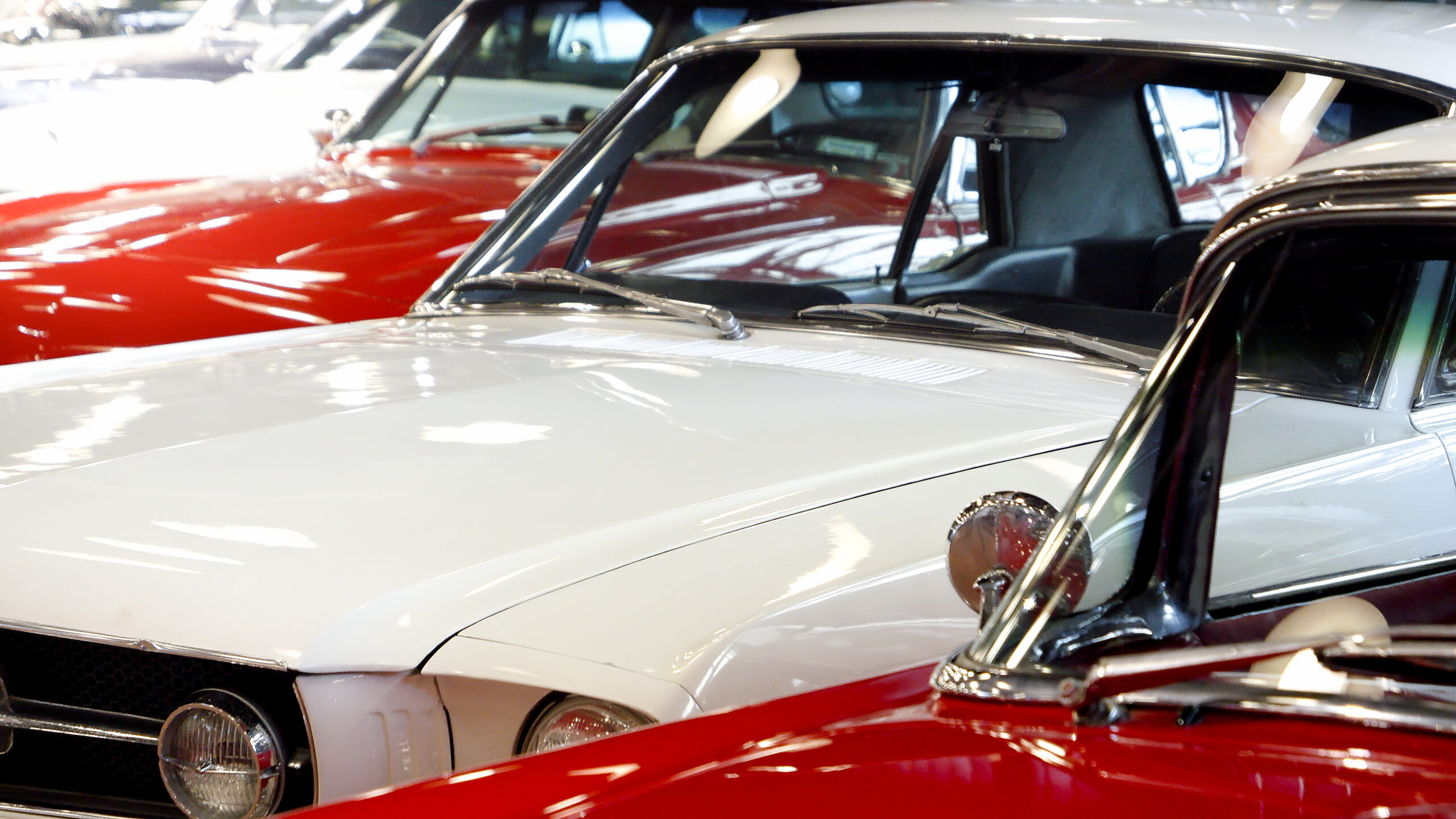 Closeup of retro cars pained in red and white